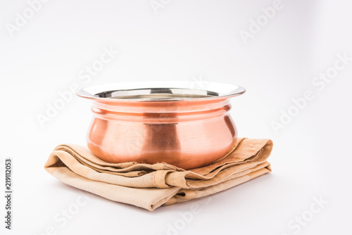 Empty Copper bowl or Handi over white background photo