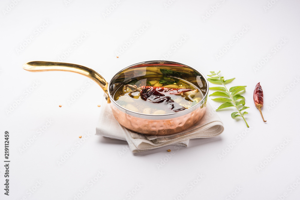 chaunk / Tadka / Tempering spices also known as baghaara, fodni, tarka or vaghaar. Typically prepared in special pan with handle. selective focus chaunk / Tadka / Tempering spices also known as baghaara, fodni, tarka or vaghaar. Typically prepared in special pan with handle. selective focus