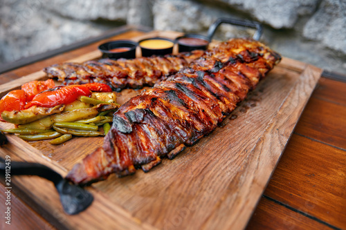 Food Closeup. Grilled Ribs In Barbecue Restaurant