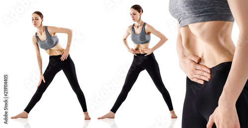 Young woman doing vacuum exercise for beautiful belly. photo