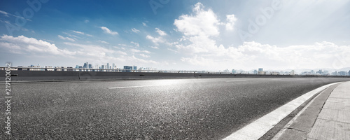 Bild auf Leinwand empty asphalt highway street with city skyline