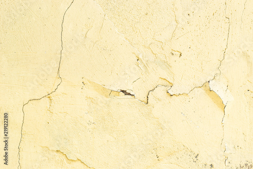 old yellow paint on a stone wall