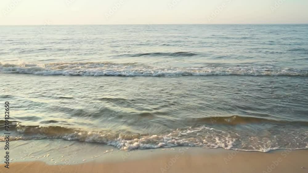 Sea water's edge in sunset time. Sea water's edge in sunset time.
