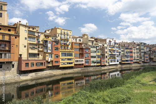 Spain, Girona, row of houses at the riverside photo