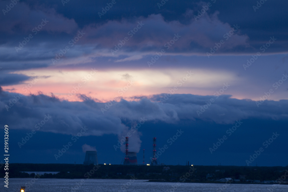 CHP pipes, power station. City industrial landscape. Twilight colored sky