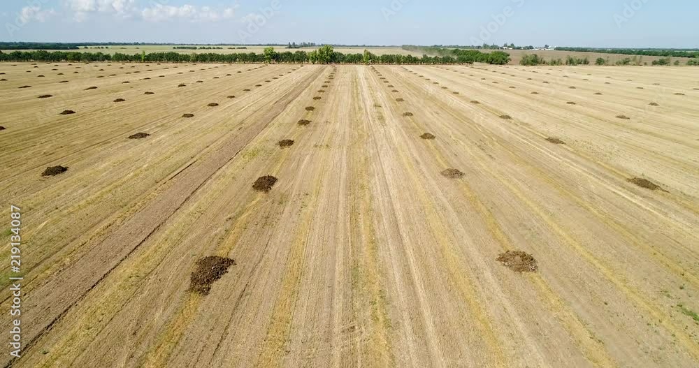 Aerial view of the field with heaps of fertilizers Aerial view of the field with heaps of fertilizers