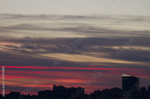 Sunset over the city. Twilight and high-rise buildings