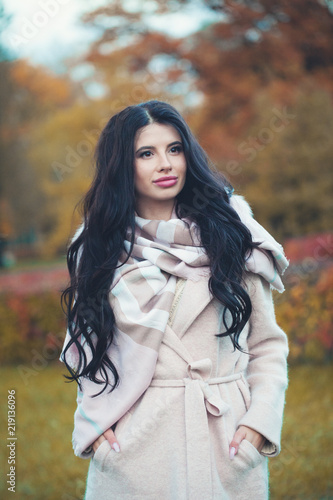 Beautiful woman wearing fashion coat in autumn outdoors © millaf