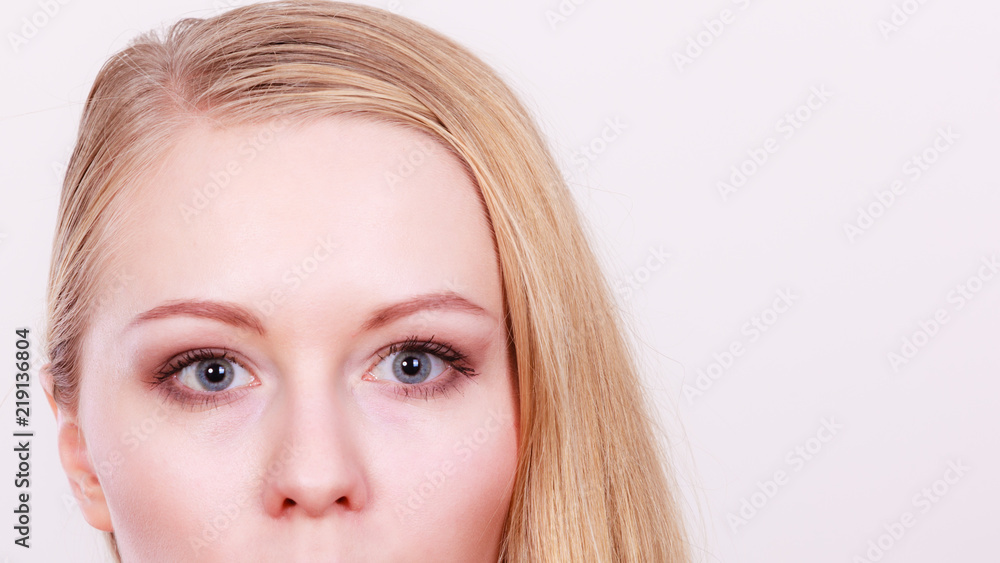 Portrait of blonde woman with grey blue eyes Portrait of blonde woman with grey blue eyes