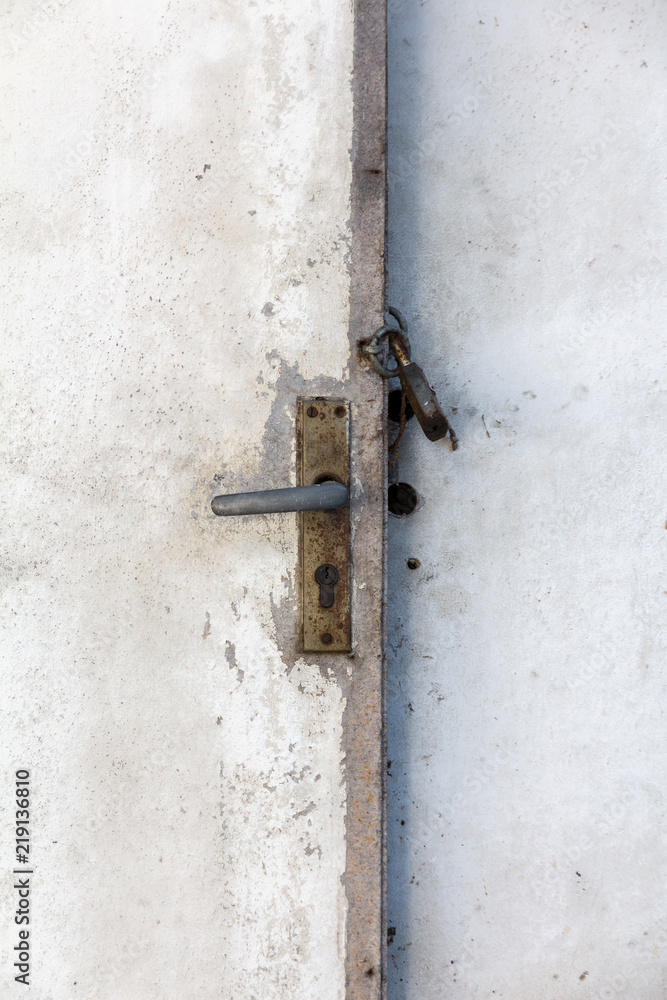 old white wooden door with a closed padlock old white wooden door with a closed padlock