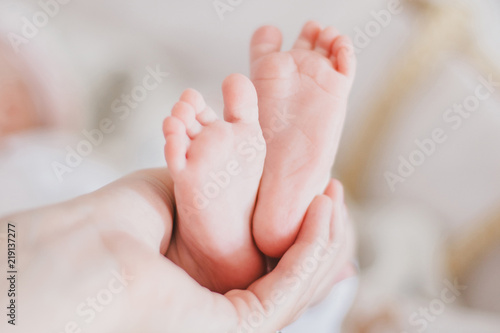 Little baby feet on a swaddle blanket © polinaloves