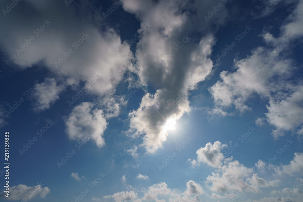 The sunny sky with white soft clouds image