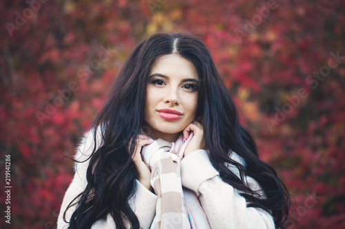 Beautiful autumn woman portrait. Young female model outdoors