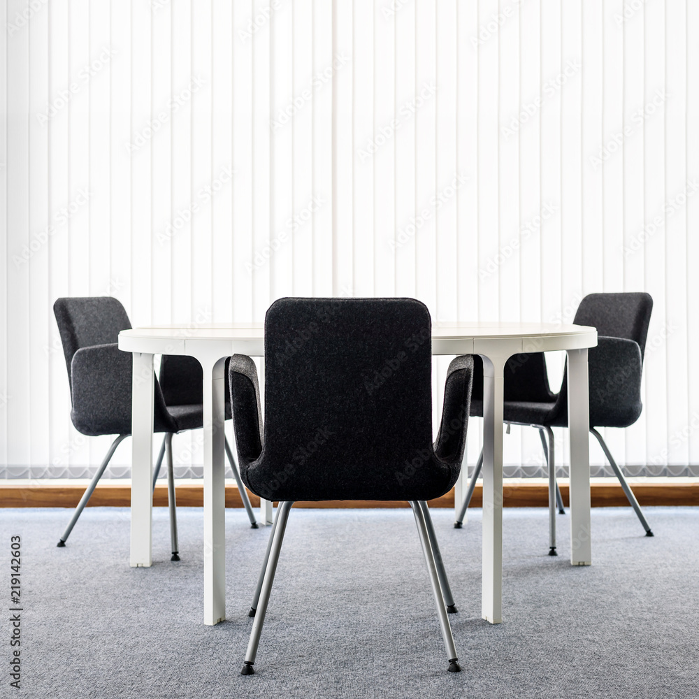 Fototapeta premium Empty White Office Room Interior with modern desk and black chair