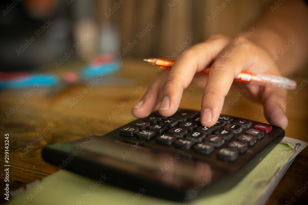 Close up man hand using calculator. Close up man hand using calculator.