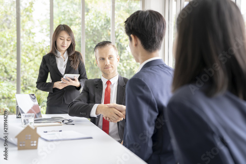 Young business man presented or discuss to client about business project in coference or meeting room.
