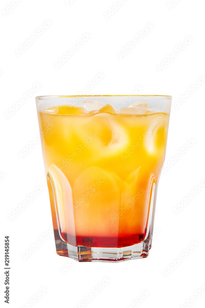 Multi-colored two-layer opaque cocktail in a low glass with ice cubes with melon, pear, apple, berries, fruit, pineapple, orange, apricot, peach. Side view Isolated white background Drink for the menu Multi-colored two-layer opaque cocktail in a low glass with ice cubes with melon, pear, apple, berries, fruit, pineapple, orange, apricot, peach. Side view Isolated white background Drink for the menu