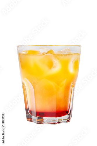 Multi-colored two-layer opaque cocktail in a low glass with ice cubes with melon, pear, apple, berries, fruit, pineapple, orange, apricot, peach. Side view Isolated white background Drink for the menu