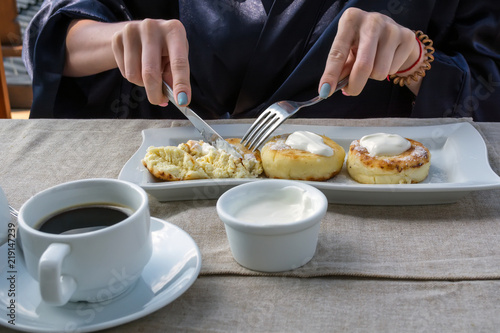 Fototapeta Naklejka Na Ścianę i Meble -  breakfast consisting of pancake with sour cream and coffee