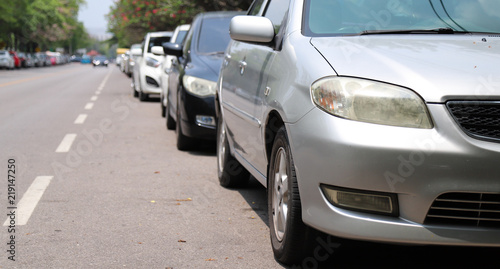 Closeup of front side view of car parking beside the street. © Amphon