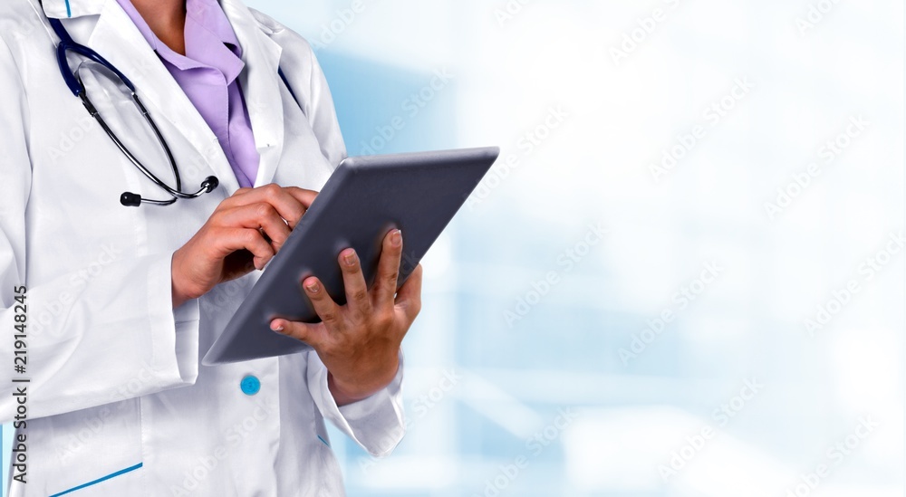 Close-up Doctor at hospital working with tablet pc Close-up Doctor at hospital working with tablet pc