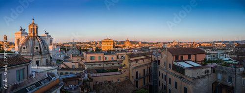 Beautiful panoramic view of the historical architecture of Rome from the roof of the building: Forum, Catholic churches, Vatican, Pantheon and other attractions in the morning sun