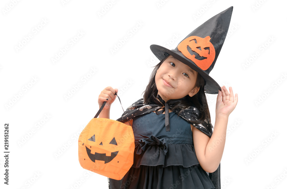 funny child girl in witch costume for Halloween