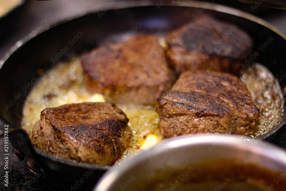 cooking fresh steak in kitchen cooking fresh steak in kitchen