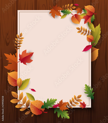 Wooden textured autumn background with beautiful fallen leaves.