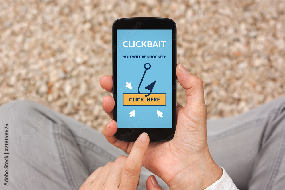 Random Images Click Using Mobile Hands holding smart phone with clickbait concept on screen. All screen ...