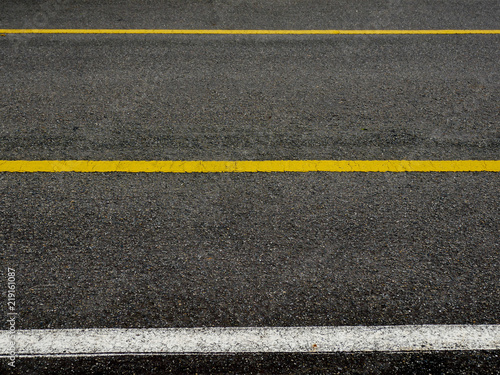 Asphalt surface of road with lines abstract background © Nattapol_Sritongcom