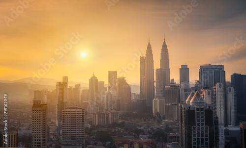 Panorama view of Kuala Lumpur business distric skyscraper with colorful sunrise sky background  Malaysia..