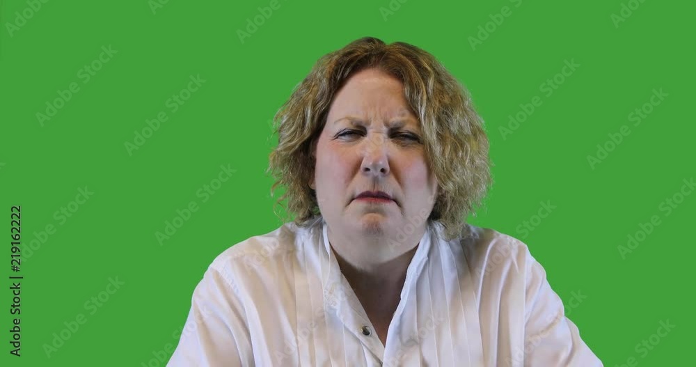 Mature woman with reading glasses, green screen