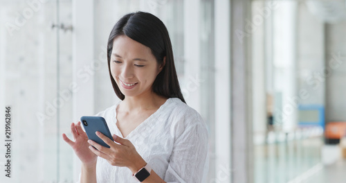 Asian woman use of mobile phone in the university campus Free Download Asian woman use of mobile phone in the university campus - GFXLoad