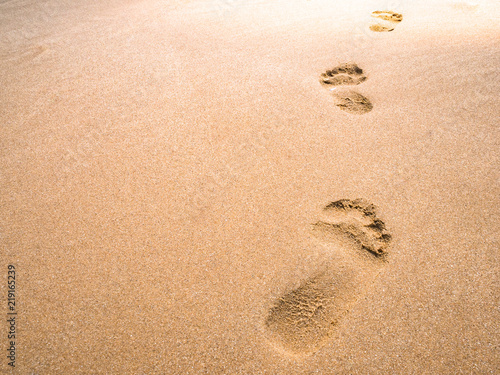 close up footprint on sand at the beach background
