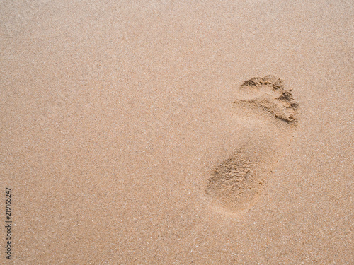 close up footprint on sand at the beach background