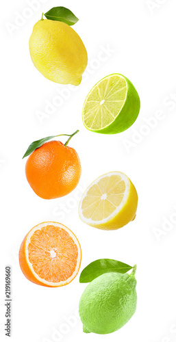 Flying orange, lime and lemon isolated on white background