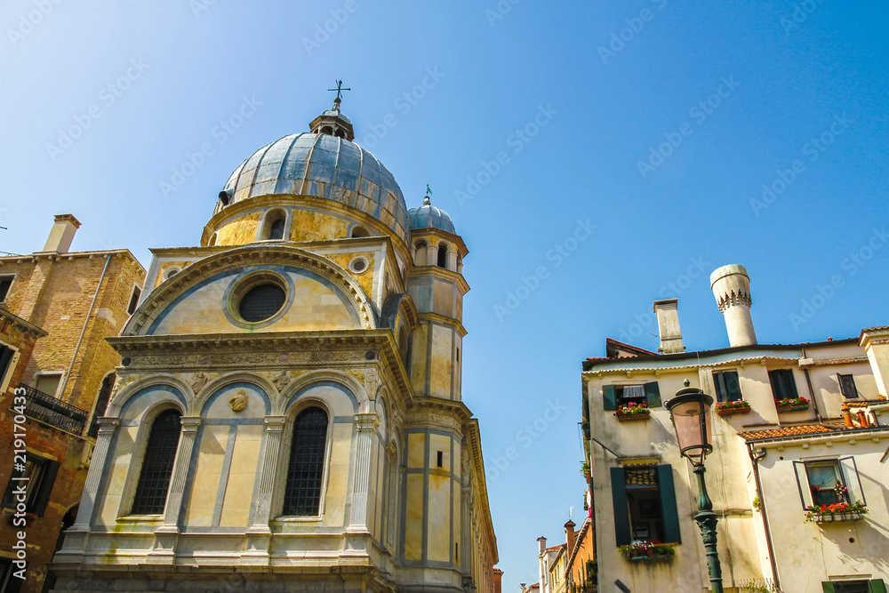 View on a historic church in Venice, Italy on a sunny day.