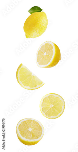 Flying lemon fruits isolated on white background