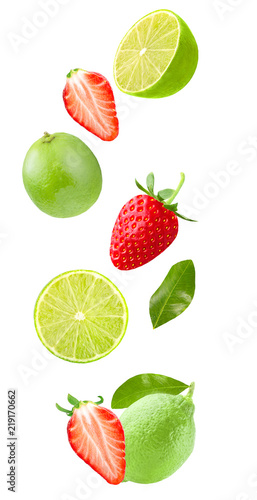 Flying lime and strawberry isolated on white background
