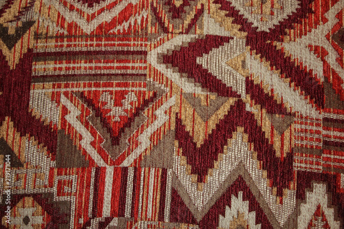 Geometric pattern on fabric texture red, burgundy and white colors