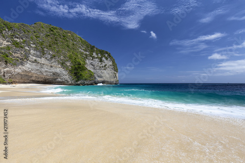 Shades of blue contrasted with white sand at Kelingking Beach on Nusa Penida in Indonesia.