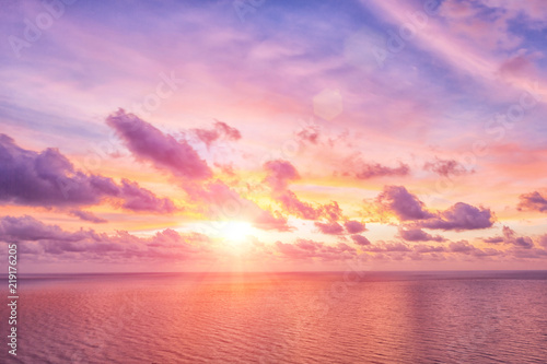 Bright sunrise or sunset  over the beach an impressive