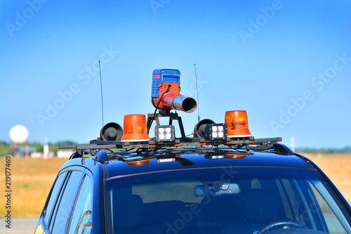 Automobile of a wildlife control on airport runway. Installation of a bird repeller on the roof of a car. photo