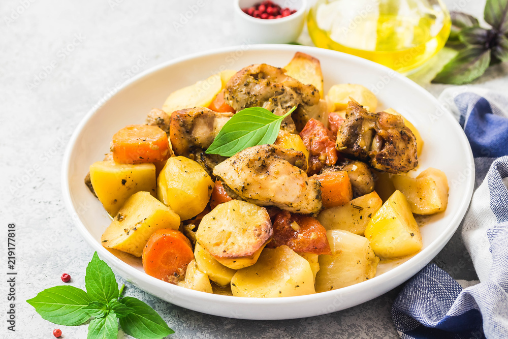 Roasted potato and carrot with lemon, garlic, spicy dressing. Selective focus, space for text. Roasted potato and carrot with lemon, garlic, spicy dressing. Selective focus, space for text.