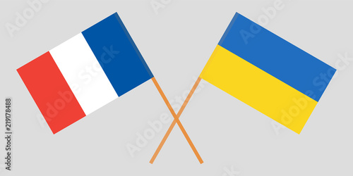 Crossed flags Ukraine and France. Official colors. Correct proportion. Vector