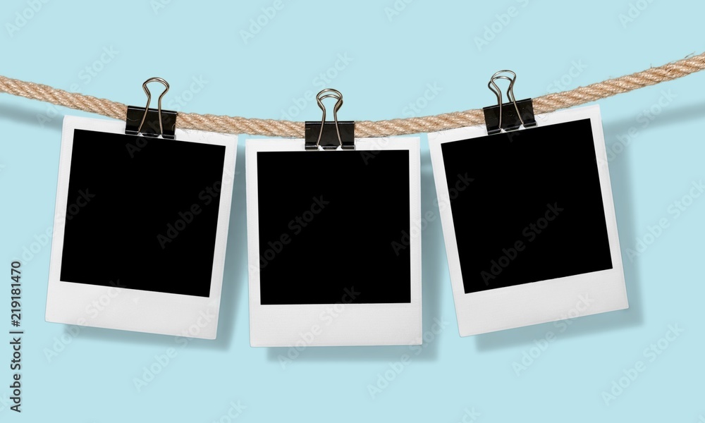 Old photoframes are hanging in the row on the abstract Old photoframes are hanging in the row on the abstract