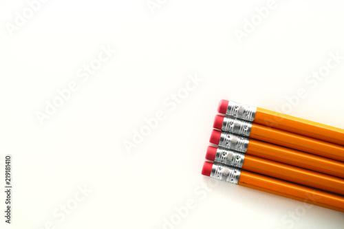 Yellow orange school homework pencils on white background