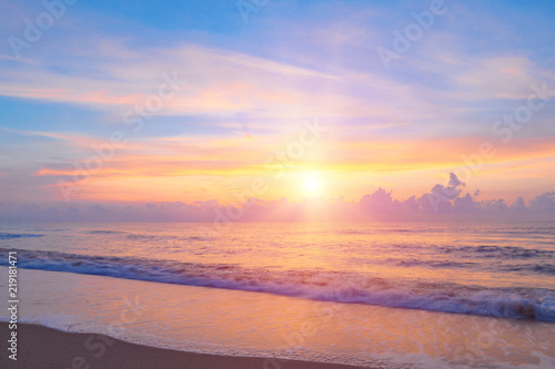Bright sunrise or sunset  over the beach an impressive