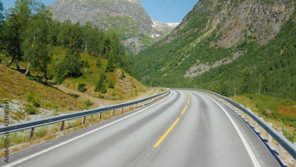Go along the scenic road among the mountains of Norway. First-person view Go along the scenic road among the mountains of Norway. First-person view